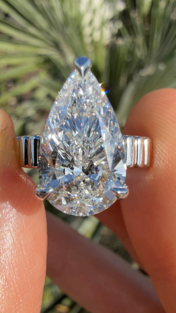 4 Carat Pear Diamond Engagement Ring with Fluted Gold Band and Hidden Halo