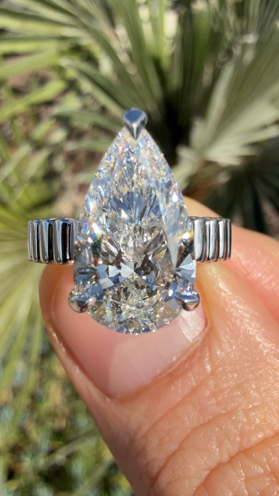 4 Carat Pear Diamond Engagement Ring with Fluted Gold Band and Hidden Halo